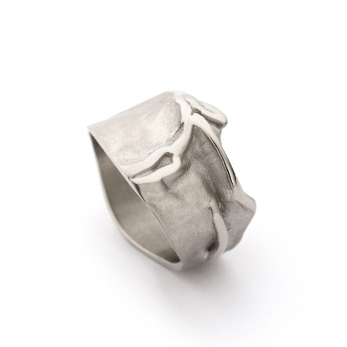 Handmade white gold ring with an organic nature-inspired design, side view